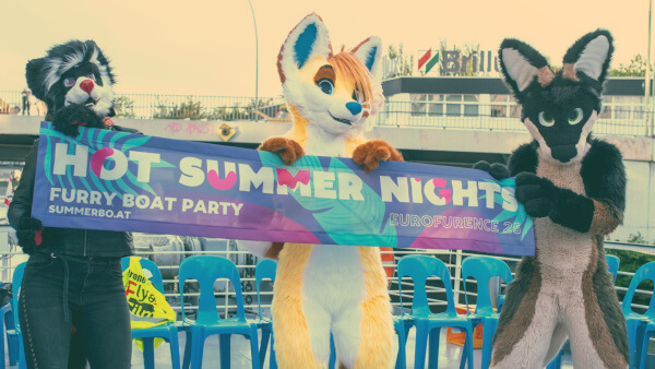 Fursuiters on the deck of a boat holding a sign which says 2019: Hot Summer Nights