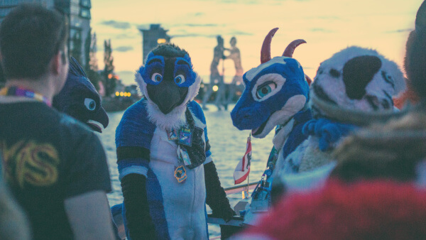 Fursuiters socialising on the deck of a boat